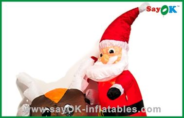 クリスマスのサンタのかわいい父のツキノワグマに乗る膨脹可能なクリスマスの装飾